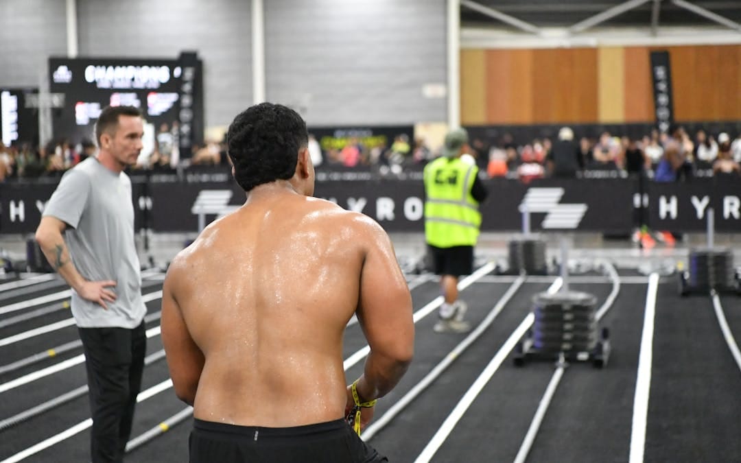 Athlete preparing for intense fitness challenge indoors at a competitive event in Singapore.